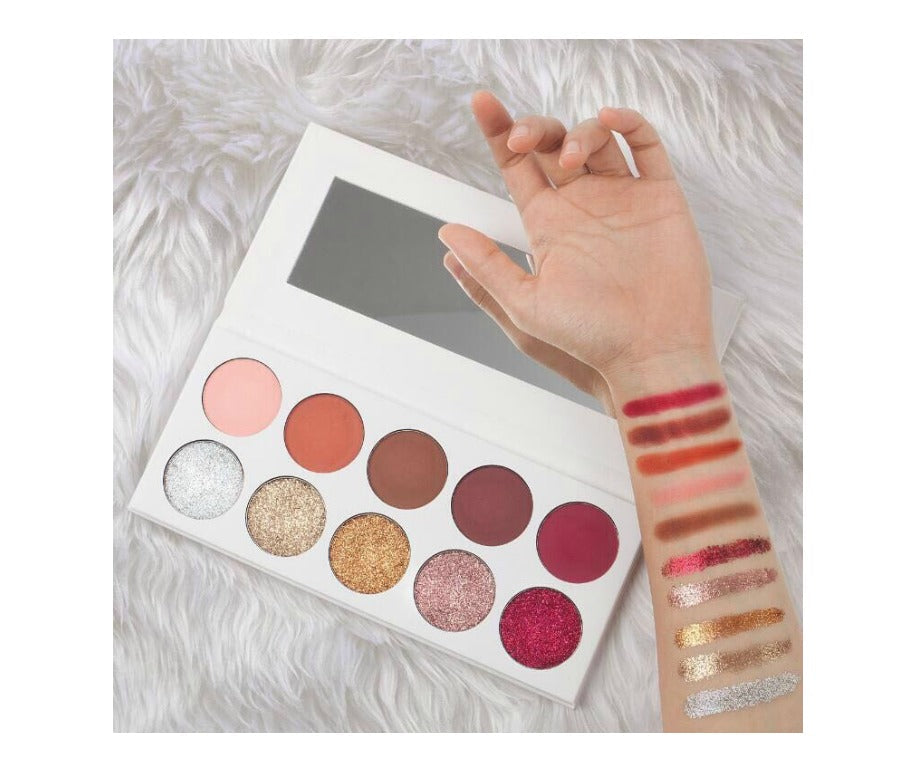 Our 10 shade Shimmer and Glitter eyeshadow palette comes in a white case with sleeve case and is sure to be a crowd pleaser! Highly pigmented, beautiful shades hand picked for their superior colors, waterproof and mixed with primer to ensure long lasting wear! With this fabulous mixture of shimmers and glitters, this eyeshadow palette will stun even the pickiest customers!      Can be customized with your logo!