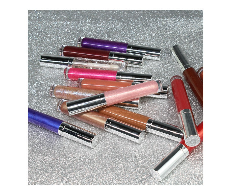 Our Shimmer Lip Gloss is an infused formula that offers gorgeous shimmer and high shine. The enriched formula conditions and offers antioxidant protection while providing non-sticky, but long-lasting color. It glistens in light, adding instant dimension to lips.    Can be hot stamped with your logo! Inquire at info@tashcosmetics.com